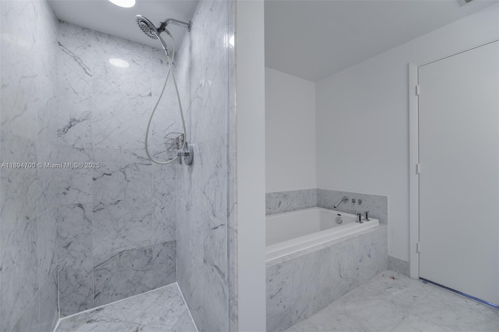 253 Northeast 2nd Street, Unit 3902 Miami, FL 33132 - Photo 18 of 47 a bathroom with a bathtub and shower