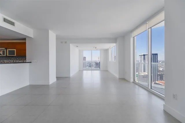 a view of a hallway with wooden shelves