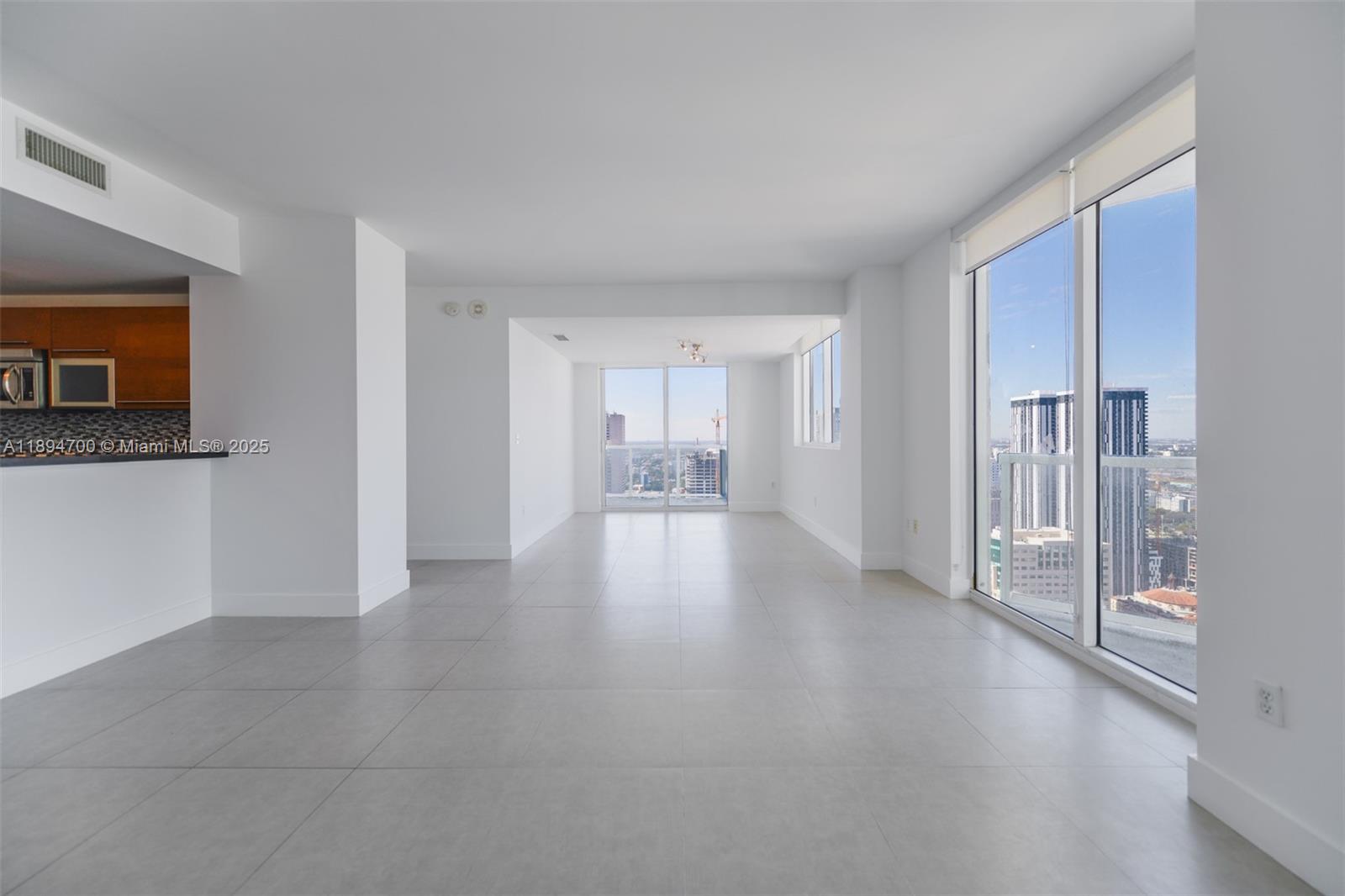 253 Northeast 2nd Street, Unit 3902 Miami, FL 33132 - Photo 2 of 47 a view of a hallway with wooden shelves