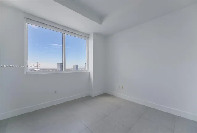 wooden floor and cabinet in an empty room