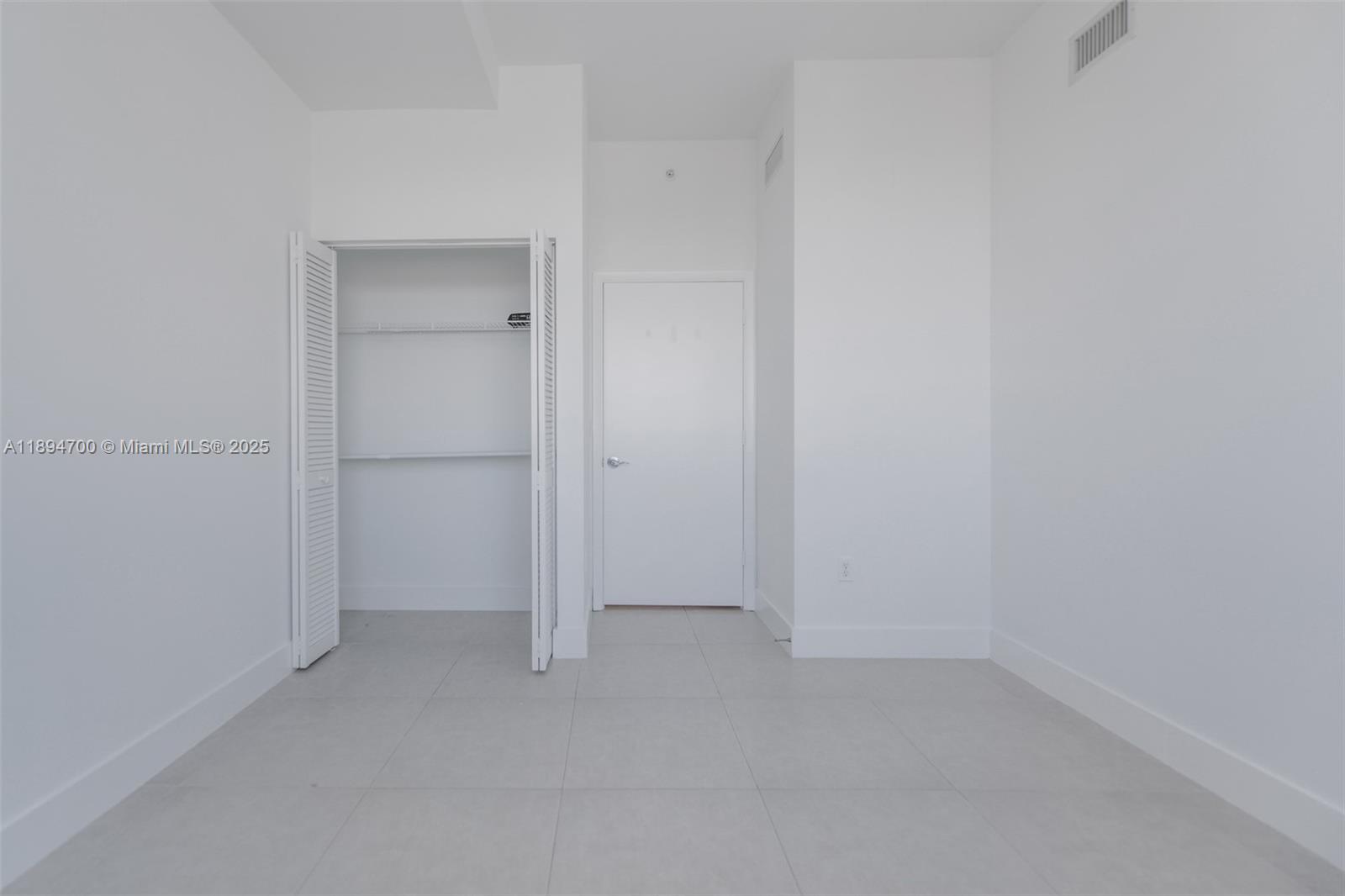 253 Northeast 2nd Street, Unit 3902 Miami, FL 33132 - Photo 22 of 47 wooden floor and cabinet in an empty room
