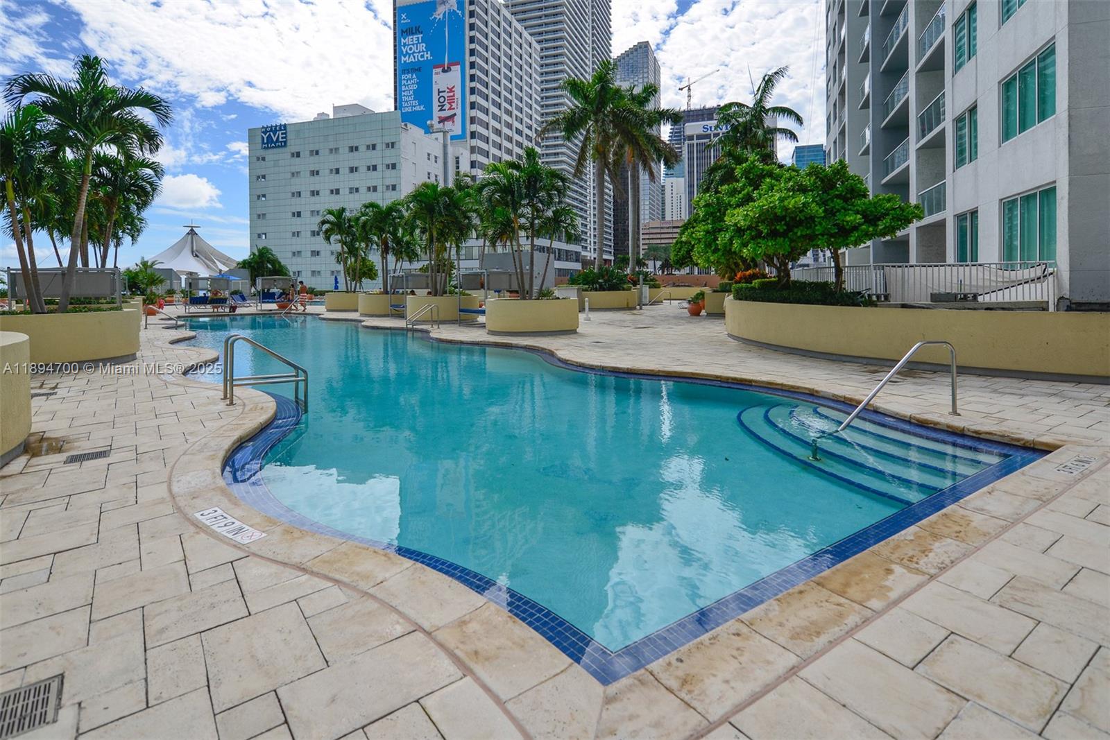 253 Northeast 2nd Street, Unit 3902 Miami, FL 33132 - Photo 27 of 47 a view of a swimming pool with a lounge chairs