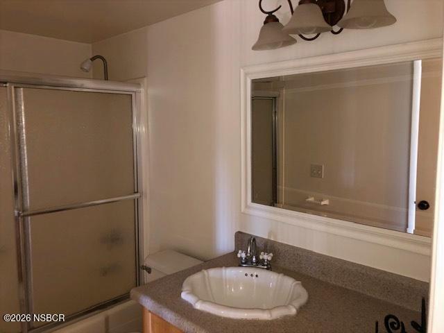 208 North R Street Lompoc, CA 93436 - Photo 13 of 22 a bathroom with a sink and a mirror