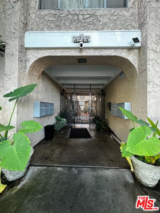 4244 East 5th Street Long Beach, CA 90814 - Photo 5 of 10 a front view of a house with a yard