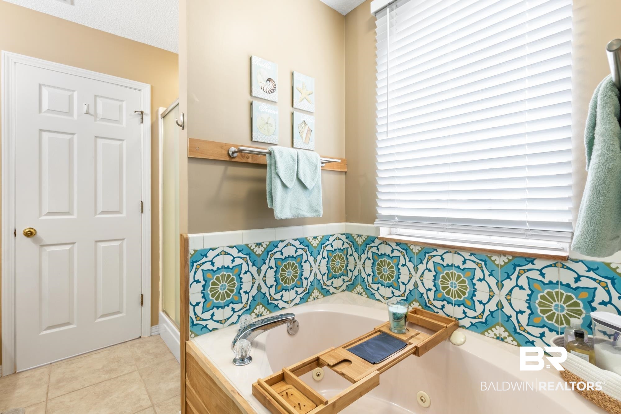 328 Windmill Ridge Road Gulf Shores, AL 36542 - Photo 22 of 47 Bathroom featuring tile patterned flooring, a textured ceiling, and a bathtub
