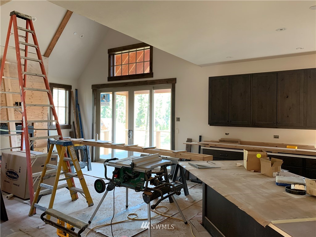 145 Maple Leaf Loop Cle Elum, WA 98922 - Photo 6 of 11 a view of a workspace with furniture and a flat screen tv