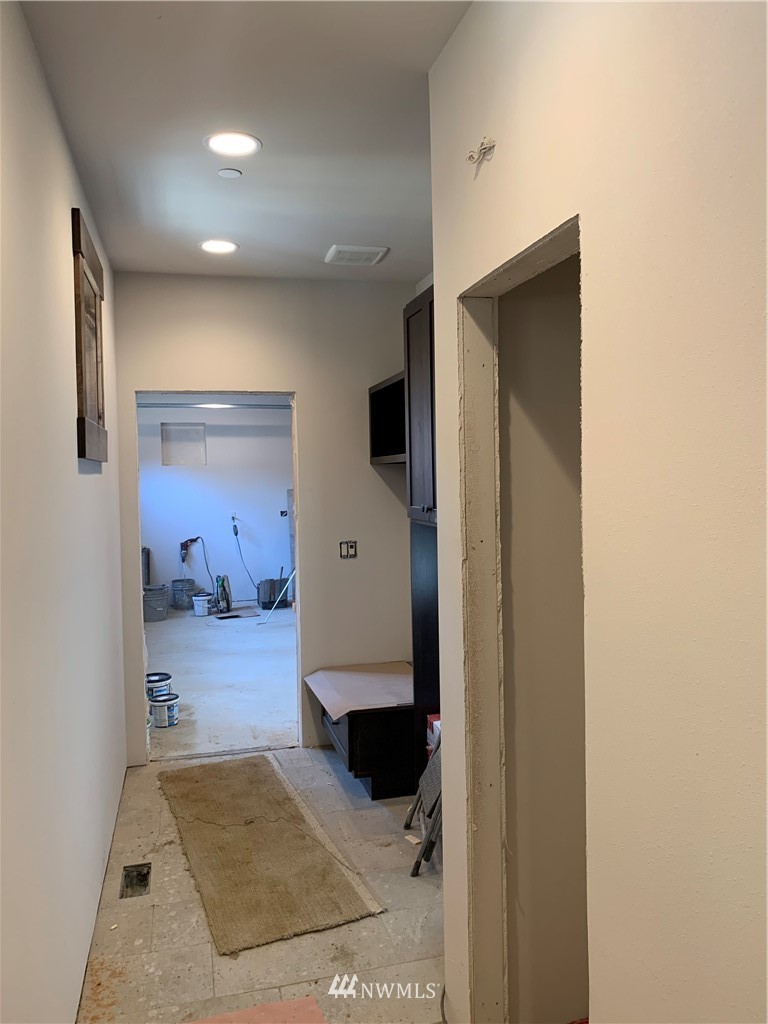 145 Maple Leaf Loop Cle Elum, WA 98922 - Photo 10 of 11 a view of a hallway with wooden floor and a bathroom