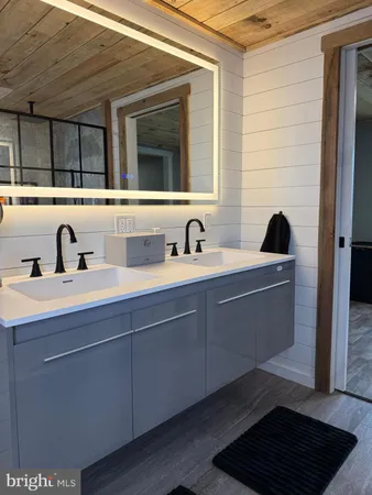 a bathroom with a sink and a mirror