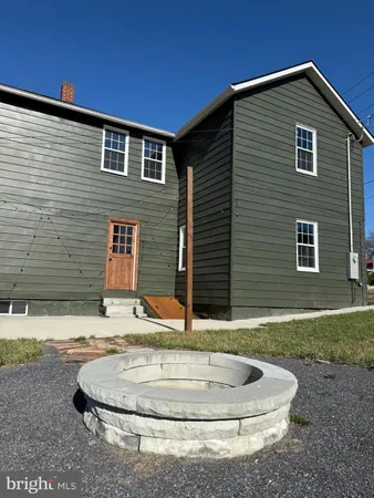 a backyard of house with outdoor seating