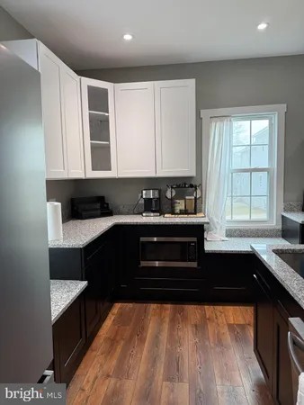 a kitchen with a sink and a stove