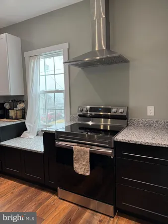 a kitchen with a stove and a microwave