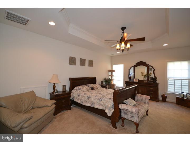 245 Barnhill Road Perkasie, PA 18944 - Photo 11 of 25 a bedroom with furniture and a mirror