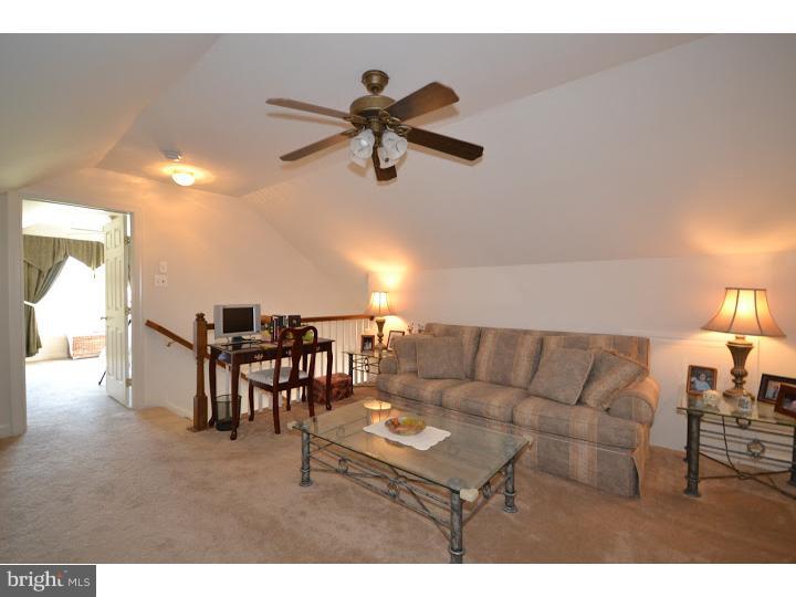245 Barnhill Road Perkasie, PA 18944 - Photo 17 of 25 a living room with furniture and a dining table