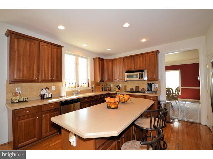 245 Barnhill Road Perkasie, PA 18944 - Photo 3 of 25 a kitchen with a sink refrigerator and cabinets