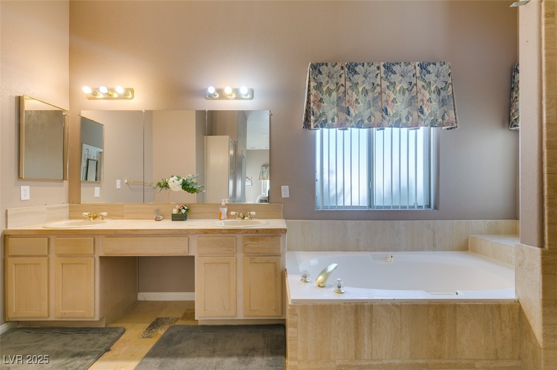 1860 Racine Drive Las Vegas, NV 89156 - Photo 16 of 36 Full bath with double vanity and a bath