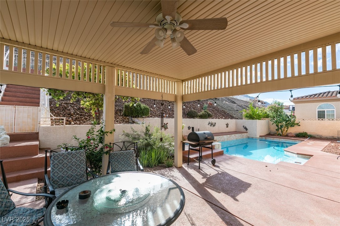 1860 Racine Drive Las Vegas, NV 89156 - Photo 18 of 36 View of swimming pool featuring a ceiling fan, a patio area, grilling area, a fenced backyard, and outdoor dining area
