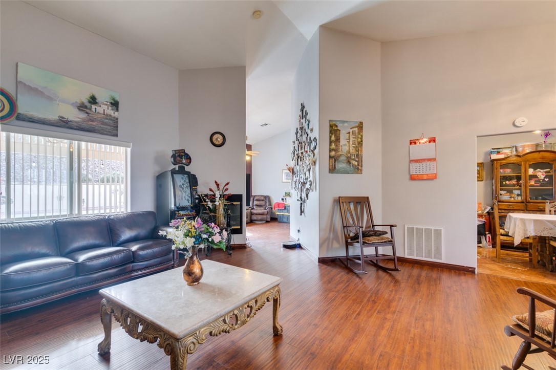 1860 Racine Drive Las Vegas, NV 89156 - Photo 24 of 36 Living area featuring a high ceiling and wood finished floors