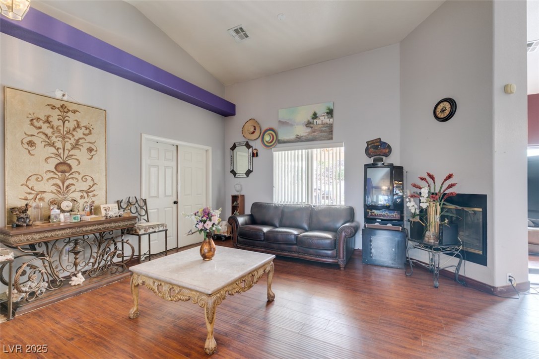 1860 Racine Drive Las Vegas, NV 89156 - Photo 25 of 36 Living room featuring lofted ceiling and wood finished floors