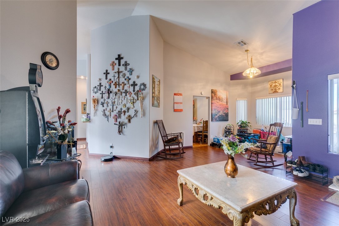 1860 Racine Drive Las Vegas, NV 89156 - Photo 28 of 36 Living area with wood finished floors and high vaulted ceiling