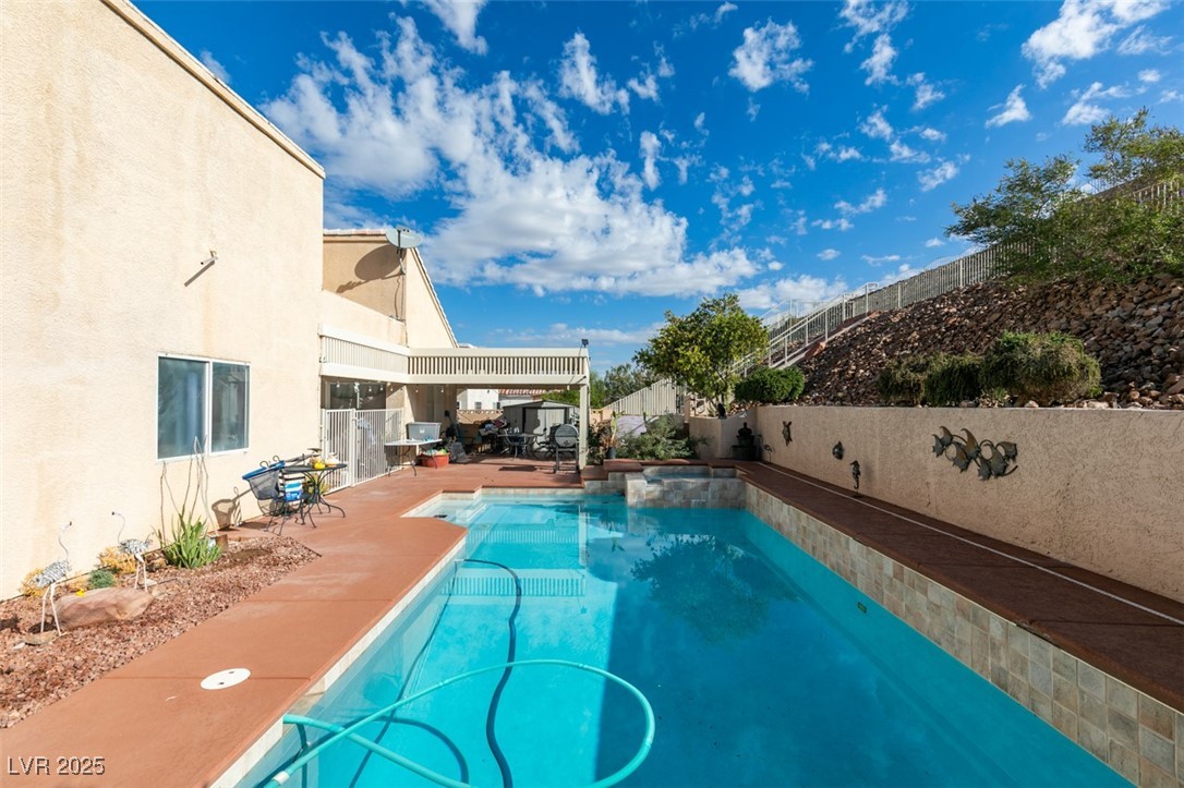 1860 Racine Drive Las Vegas, NV 89156 - Photo 3 of 36 View of pool featuring a fenced backyard, a patio, and a pool with connected hot tub