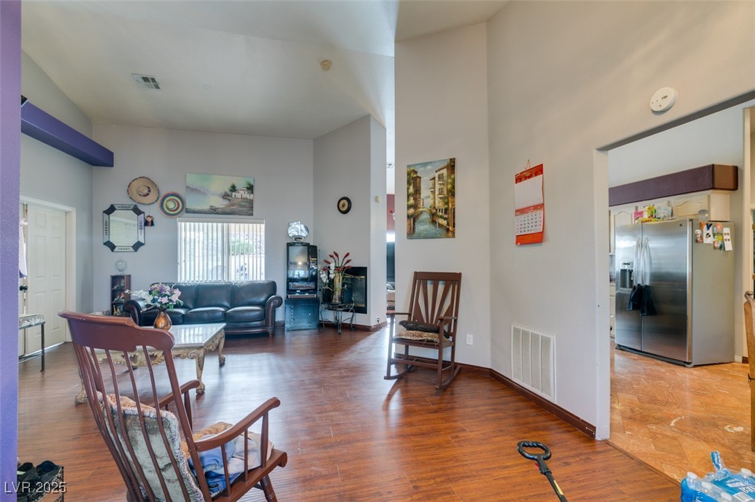 1860 Racine Drive Las Vegas, NV 89156 - Photo 31 of 36 Living room with wood finished floors and a towering ceiling