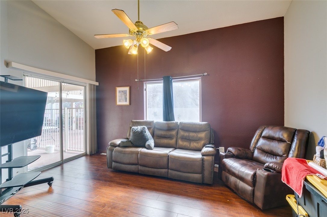1860 Racine Drive Las Vegas, NV 89156 - Photo 33 of 36 Living room featuring high vaulted ceiling, wood-type flooring, and a ceiling fan