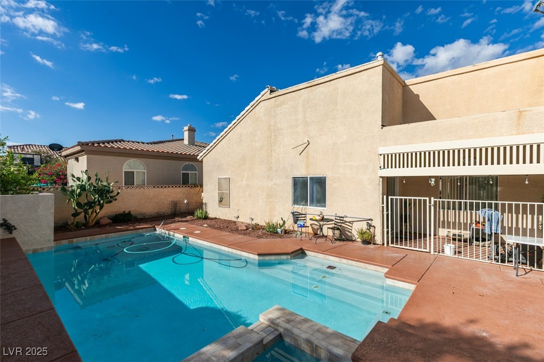 1860 Racine Drive Las Vegas, NV 89156 - Photo 4 of 36 View of swimming pool with a patio area and a pool with connected hot tub