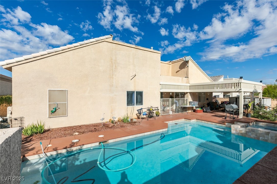 1860 Racine Drive Las Vegas, NV 89156 - Photo 5 of 36 View of pool with a patio area and a pool with connected hot tub