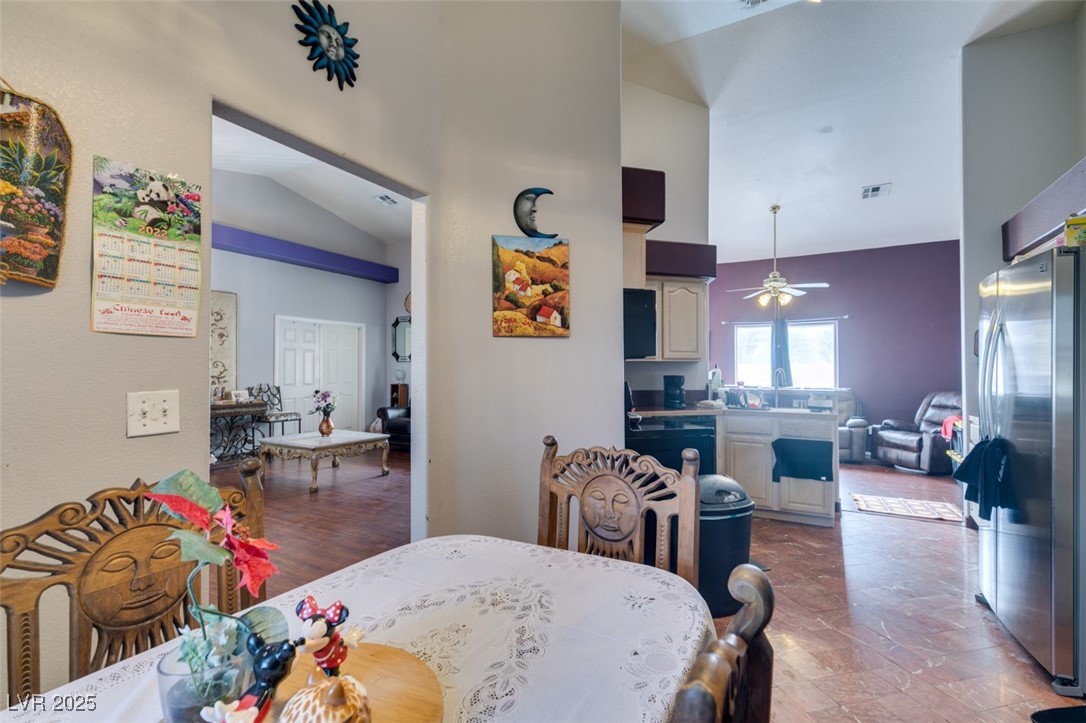 1860 Racine Drive Las Vegas, NV 89156 - Photo 8 of 36 Dining room with high vaulted ceiling and a ceiling fan