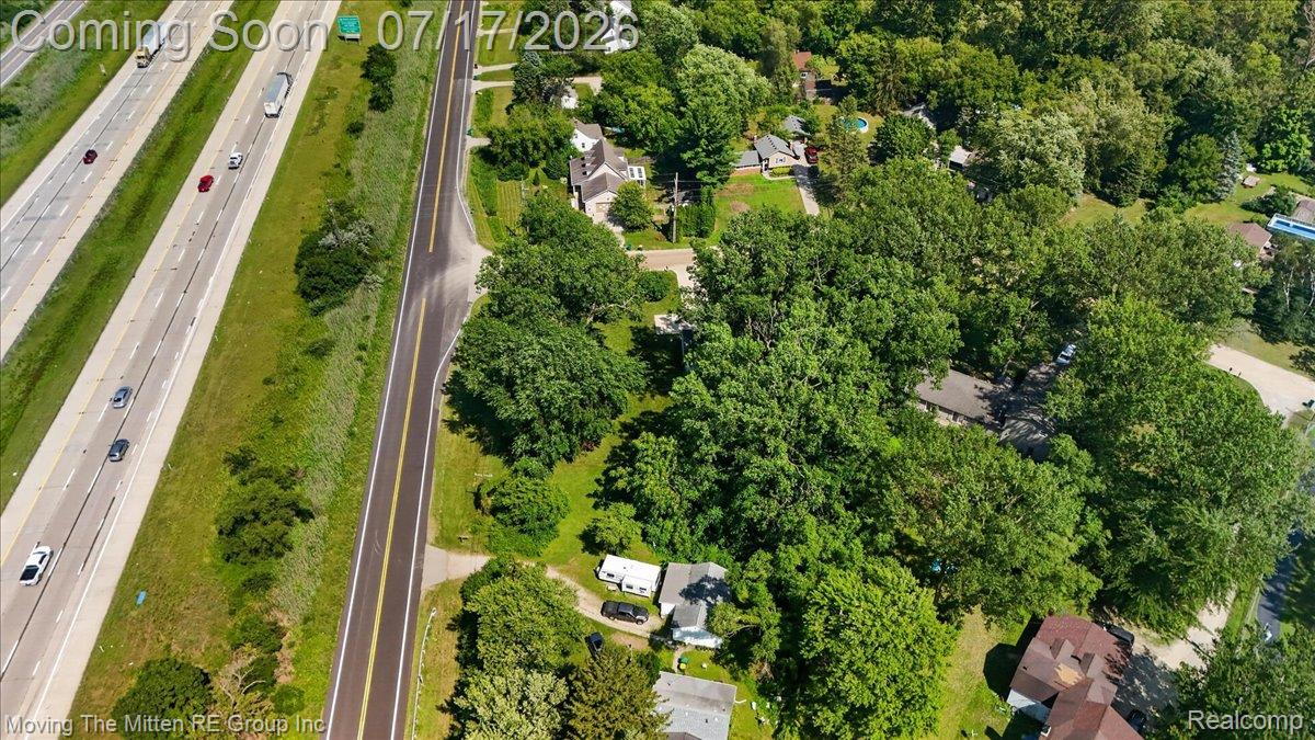 40162 Alden Road Belleville, MI 48111 - Photo 58 of 67 Aerial perspective showcasing a residential area with extensive tree coverage