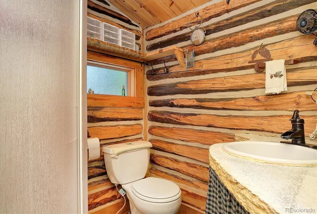 a bathroom with a toilet and a sink