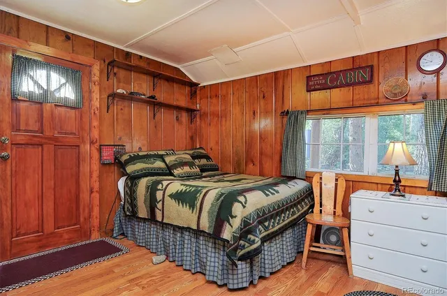 a bed room with a bed and a window