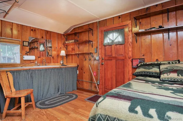 a room with furniture and a painting on the wall