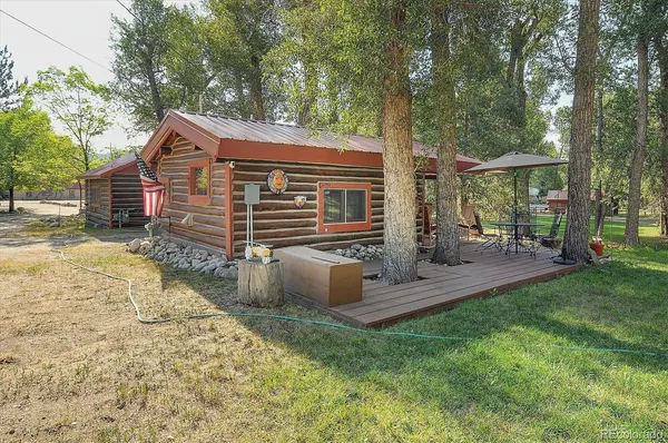 a view of house with a yard