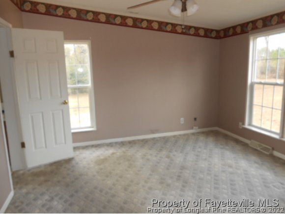 2454 Ebenezer Church Road Coats, NC 27521 - Photo 5 of 8 a view of an empty room with a window