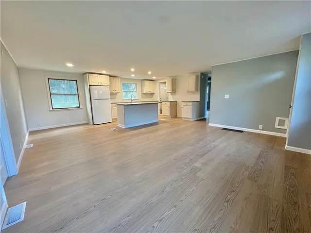 a view of a kitchen with a sink and a window