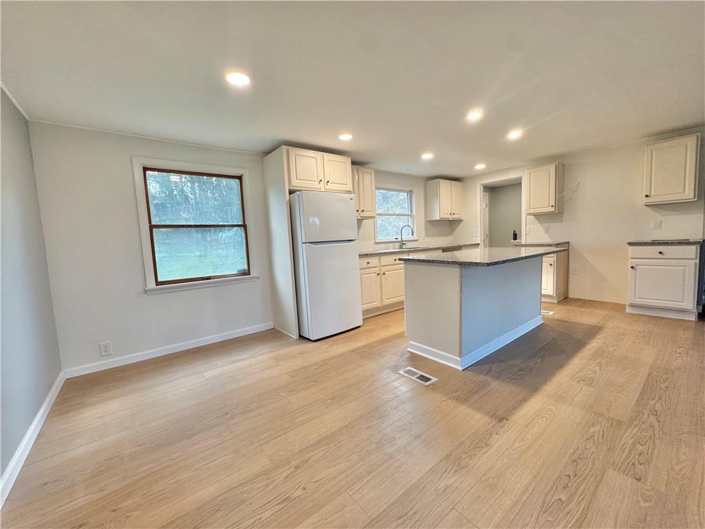 1285 Old Pulaski Road New Castle, PA 16105 - Photo 5 of 19 a view of kitchen with cabinets and refrigerator