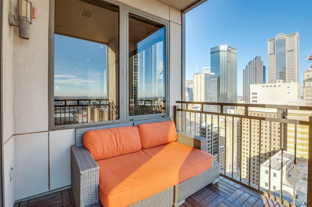 1200 Main Street, Unit 2412 Dallas, TX 75202 - Photo 26 of 36 a balcony with furniture and wooden floor