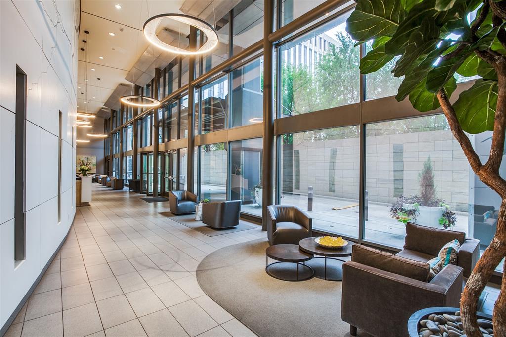 1200 Main Street, Unit 2412 Dallas, TX 75202 - Photo 27 of 36 a lobby with furniture and floor to ceiling window