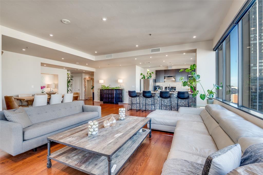 1200 Main Street, Unit 2412 Dallas, TX 75202 - Photo 3 of 36 a living room with furniture and a large window