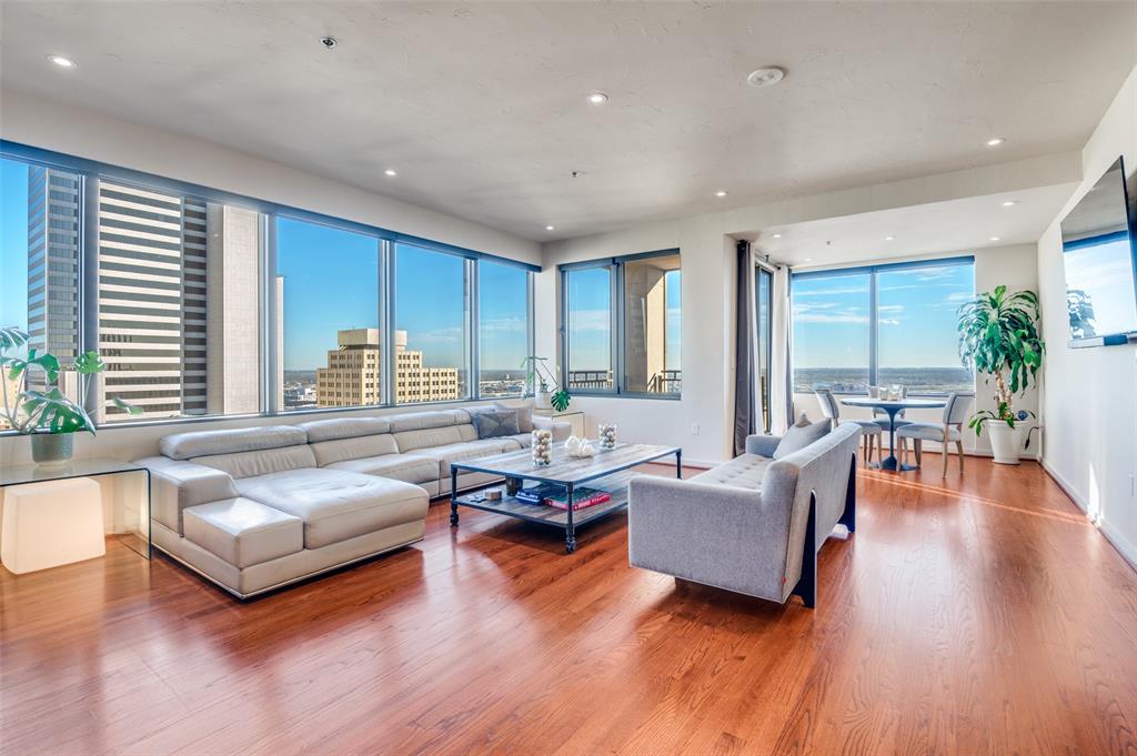 1200 Main Street, Unit 2412 Dallas, TX 75202 - Photo 4 of 36 a living room with furniture and a large window