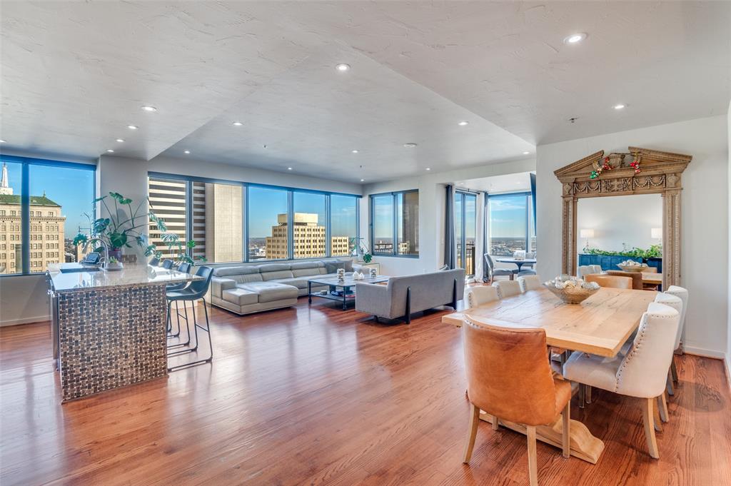 1200 Main Street, Unit 2412 Dallas, TX 75202 - Photo 7 of 36 a view of a dining room with furniture window and wooden floor