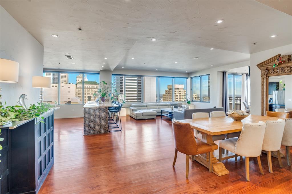 1200 Main Street, Unit 2412 Dallas, TX 75202 - Photo 8 of 36 a view of a dining room with furniture and wooden floor