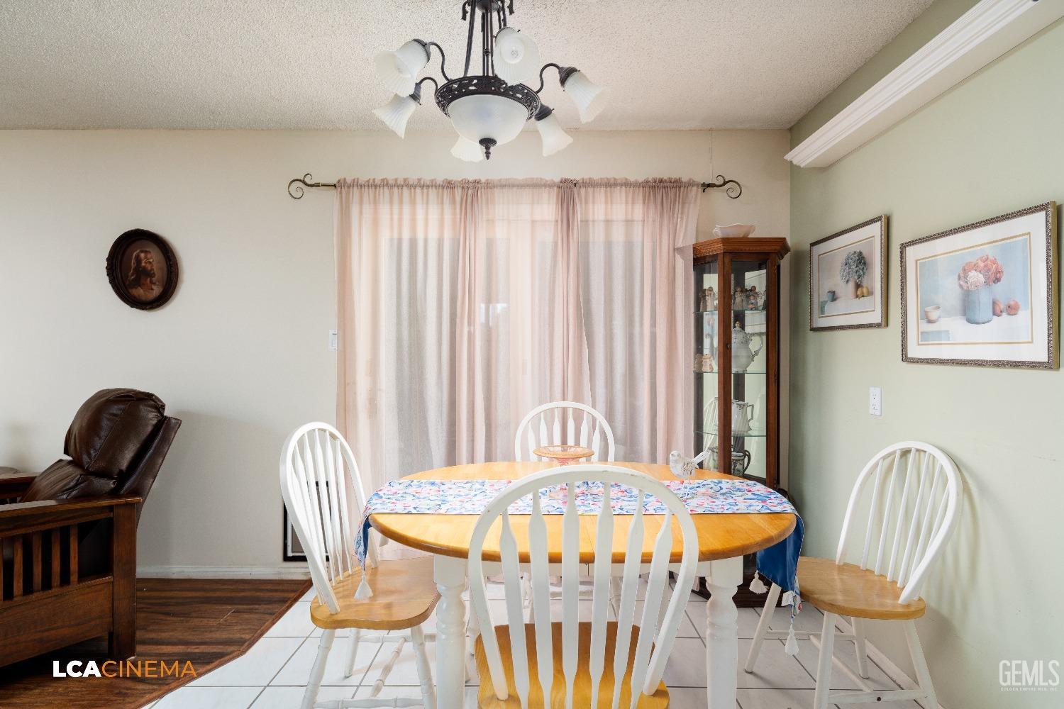Undisclosed Address Bakersfield, CA 93306 - Photo 13 of 27 a view of a dining room with furniture and window
