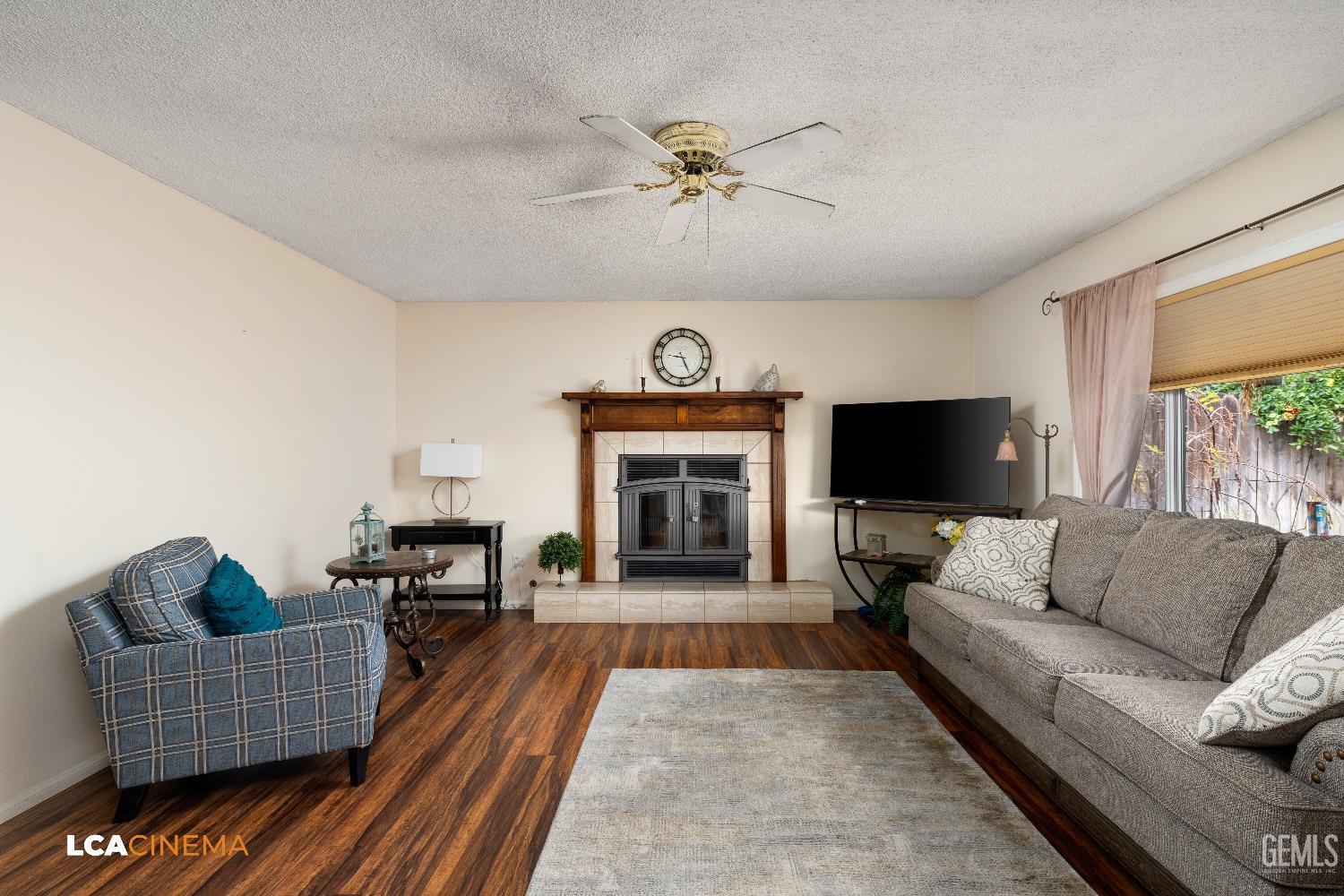 Undisclosed Address Bakersfield, CA 93306 - Photo 16 of 27 a living room with furniture and a fireplace