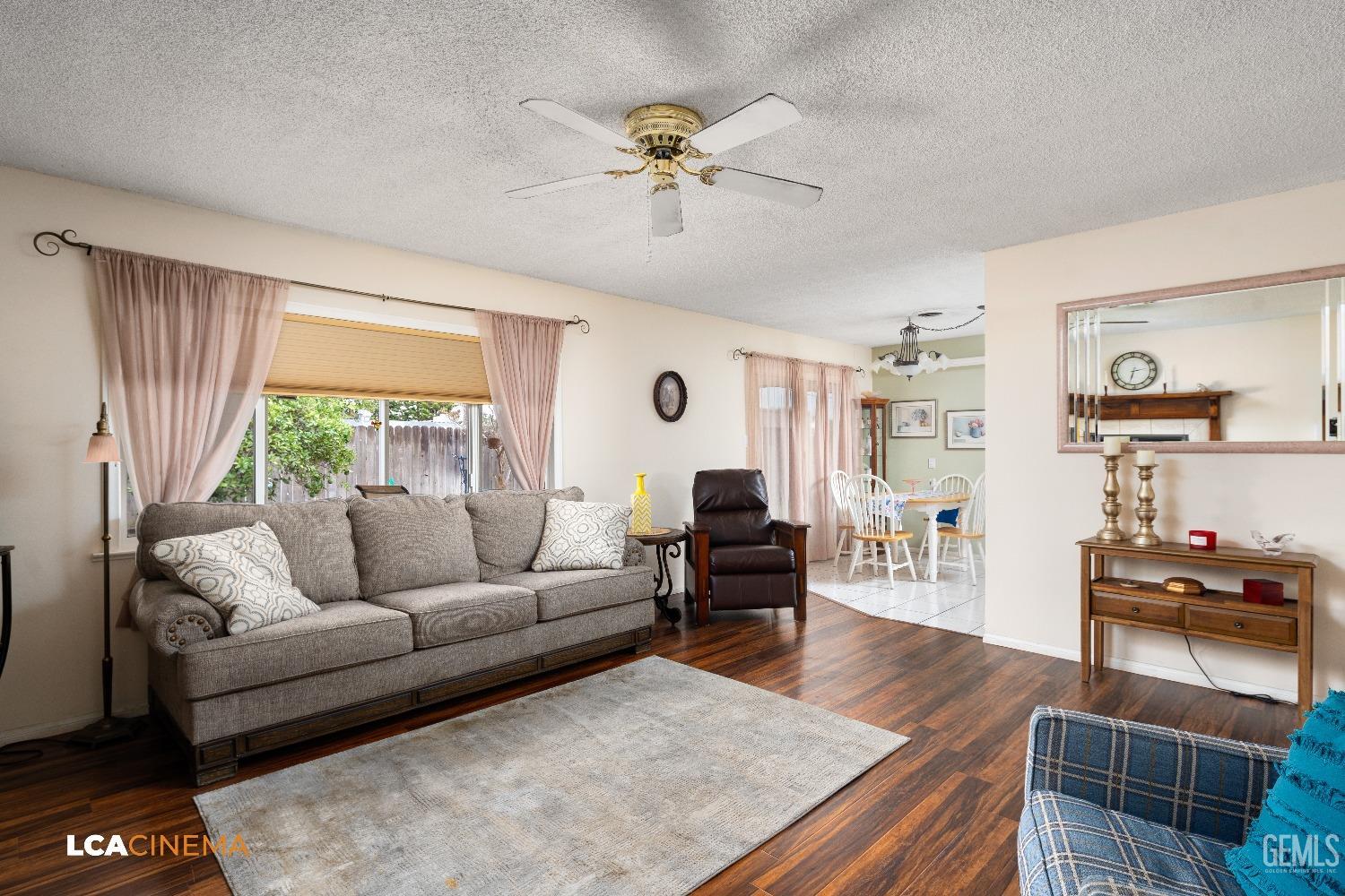 Undisclosed Address Bakersfield, CA 93306 - Photo 17 of 27 a living room with furniture and a large window