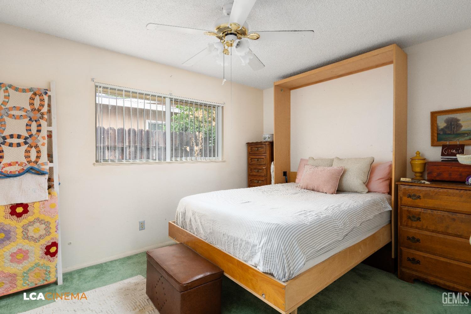 Undisclosed Address Bakersfield, CA 93306 - Photo 18 of 27 a bedroom with a bed and a chandelier
