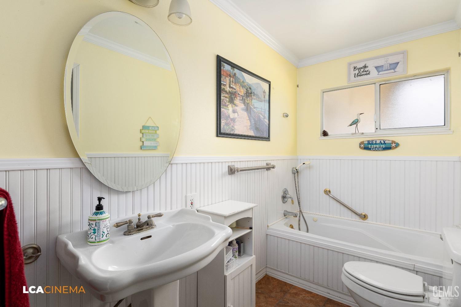 Undisclosed Address Bakersfield, CA 93306 - Photo 19 of 27 a bathroom with a sink a toilet and a mirror