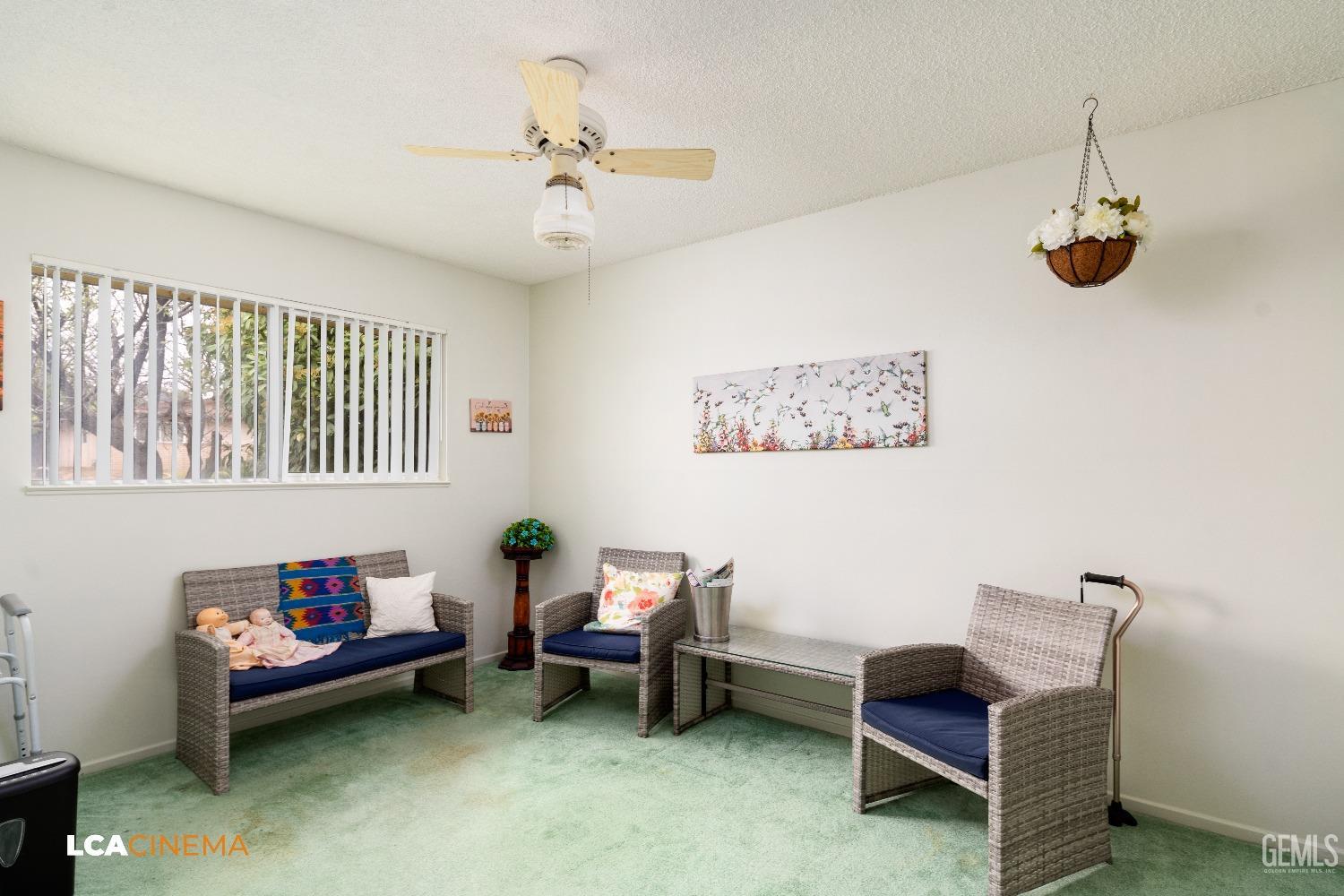Undisclosed Address Bakersfield, CA 93306 - Photo 20 of 27 a living room with furniture and a ceiling fan