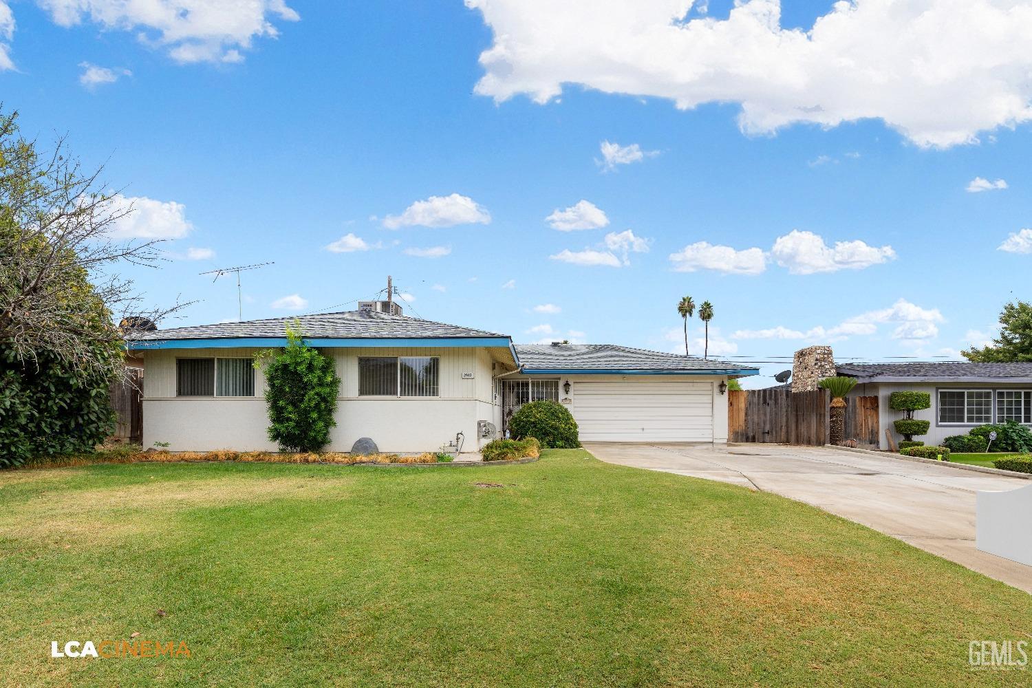 Undisclosed Address Bakersfield, CA 93306 - Photo 2 of 27 a front view of a house with garden